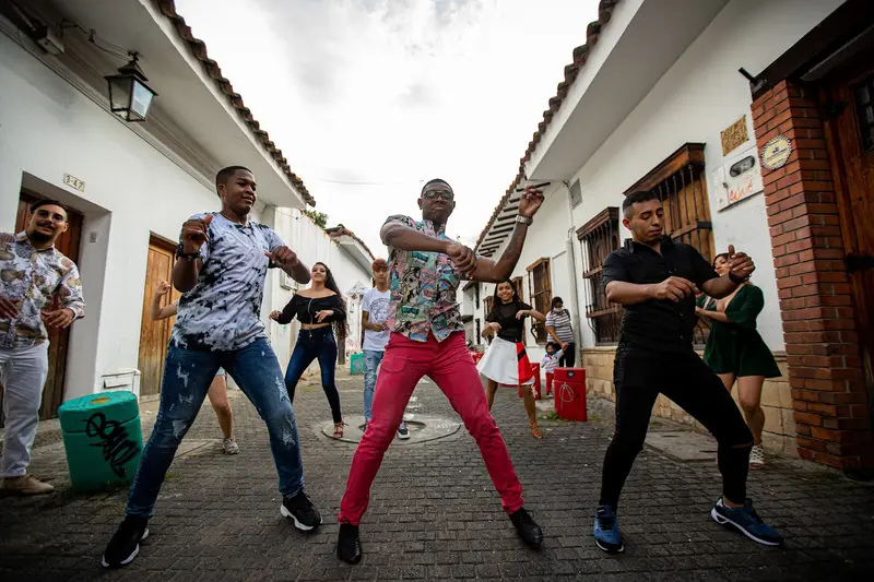 Dancers performing salsa on a Cali street