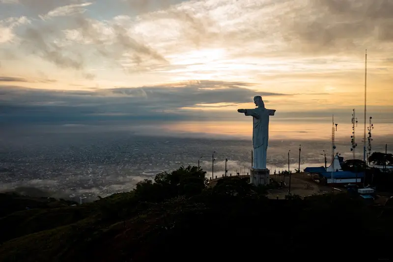 Cristo Rey at dusk above the city